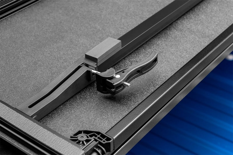 Lund Dodge Ram 1500 Fleetside (6.4ft. Bed) Hard Fold Tonneau Cover - Black