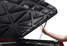 Load image into Gallery viewer, UnderCover Nissan Frontier 5ft Elite Bed Cover - Black Textured